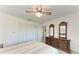 Bedroom with double bed, wooden dresser, and ceiling fan at 2119 Zipperer Rd, Bradenton, FL 34212