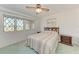 Bedroom with double bed, wooden dresser, and ceiling fan at 2119 Zipperer Rd, Bradenton, FL 34212