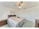 Bedroom with double bed, wooden dresser, and ceiling fan at 2119 Zipperer Rd, Bradenton, FL 34212