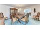 Formal dining room with wood table and chandelier at 2119 Zipperer Rd, Bradenton, FL 34212