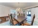 Dining room with chandelier and access to a sunroom at 2119 Zipperer Rd, Bradenton, FL 34212