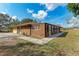 Brick house with attached sunroom and walkway at 2119 Zipperer Rd, Bradenton, FL 34212