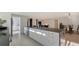 Modern kitchen with sleek white cabinets and dark countertops at 2133 Oriole Dr, Sarasota, FL 34239