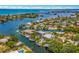 Aerial view of waterfront home with private dock and boat access at 238 Oak Ave, Anna Maria, FL 34216