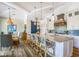 Modern kitchen with white cabinets, large island, and blue tile backsplash at 238 Oak Ave, Anna Maria, FL 34216