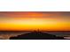 Silhouette of people fishing on pier at sunset at 238 Oak Ave, Anna Maria, FL 34216