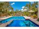 Stunning pool with spa and tropical landscaping at 238 Oak Ave, Anna Maria, FL 34216