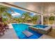 Relaxing pool and spa with covered patio at 238 Oak Ave, Anna Maria, FL 34216