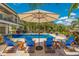 Enjoy this amazing pool area with lounge chairs at 238 Oak Ave, Anna Maria, FL 34216