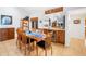 Bright dining room with a wooden table, built in bar, and hardwood floors at 30 Tidy Island Blvd, Bradenton, FL 34210