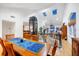 Elegant dining room features a large wooden table with blue patterned runner, and a home elevator is visible at 30 Tidy Island Blvd, Bradenton, FL 34210