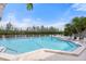 Inviting community pool with lounge chairs and waterfront views at 30 Tidy Island Blvd, Bradenton, FL 34210