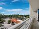 Expansive balcony offering panoramic views of the lush landscape and clear blue skies, perfect for relaxation at 3060 Grand Bay Blvd # 124, Longboat Key, FL 34228