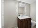 Elegant bathroom showcasing a modern vanity with marble countertop, mirror, and a toilet at 3060 Grand Bay Blvd # 124, Longboat Key, FL 34228