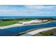 Scenic view of a golf course and bay with crystal blue water creating a peaceful backdrop at 3060 Grand Bay Blvd # 124, Longboat Key, FL 34228