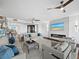 Bright living room featuring a modern fireplace, stylish furniture, and ceiling fans for comfortable living at 3060 Grand Bay Blvd # 124, Longboat Key, FL 34228