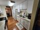 Clean and functional kitchen with white cabinets and laminate counters at 308 Danube Cir, Bradenton, FL 34207