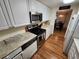 Kitchen with stainless steel appliances and light wood floors at 308 Danube Cir, Bradenton, FL 34207