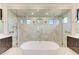 Luxurious bathroom with a large soaking tub and walk-in shower at 3123 Founders Club Dr, Sarasota, FL 34240