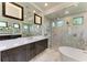 Spa-like bathroom with a walk-in shower, soaking tub and dual vanities at 3123 Founders Club Dr, Sarasota, FL 34240