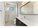 Modern bathroom with a glass shower, stylish tile, and a quartz vanity at 3123 Founders Club Dr, Sarasota, FL 34240