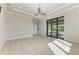 Bright and spacious bedroom with hardwood floors and sliding glass doors leading to the pool at 3123 Founders Club Dr, Sarasota, FL 34240