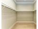 Spacious walk-in closet featuring built-in shelving at 3123 Founders Club Dr, Sarasota, FL 34240