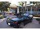 Luxury community clubhouse with several luxury cars parked outside at 3123 Founders Club Dr, Sarasota, FL 34240