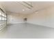 Large garage with epoxy flooring and ample storage space at 3123 Founders Club Dr, Sarasota, FL 34240