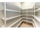 Walk-in pantry with ample shelving for storage at 3123 Founders Club Dr, Sarasota, FL 34240