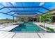 Resort-style pool with covered patio and lounge chairs at 3123 Founders Club Dr, Sarasota, FL 34240