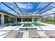 Relaxing pool and spa with covered patio and seating at 3123 Founders Club Dr, Sarasota, FL 34240