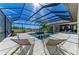 Luxury pool and patio area with screened enclosure at 3123 Founders Club Dr, Sarasota, FL 34240