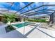 Stunning pool and spa with covered patio and lounge chairs at 3123 Founders Club Dr, Sarasota, FL 34240