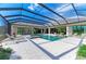 Luxury pool and spa with covered patio and seating at 3123 Founders Club Dr, Sarasota, FL 34240