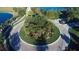 Landscaped roundabout entrance to a community at 3123 Founders Club Dr, Sarasota, FL 34240