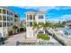 Three-story house with balconies, a private driveway, and a pool at 317 Beach Rd, Sarasota, FL 34242