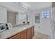 Well-appointed bathroom with granite vanity and updated fixtures at 317 Beach Rd, Sarasota, FL 34242