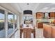 Bright dining area with wooden table and access to a balcony at 317 Beach Rd, Sarasota, FL 34242