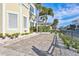 Landscaped front yard with brick pavers at 317 Beach Rd, Sarasota, FL 34242