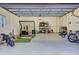 Spacious garage with golf simulator and gym equipment at 317 Beach Rd, Sarasota, FL 34242