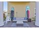 Relaxing patio with wicker furniture and paddleboards at 317 Beach Rd, Sarasota, FL 34242