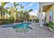 Inviting kidney-shaped pool with spa and lounge area at 317 Beach Rd, Sarasota, FL 34242