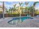 Inviting kidney-shaped pool with spa and lounge area at 317 Beach Rd, Sarasota, FL 34242