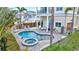 Inviting kidney-shaped pool with spa and lounge area at 317 Beach Rd, Sarasota, FL 34242