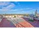 Spacious rooftop deck with lounge chairs, grill, and city views at 317 Beach Rd, Sarasota, FL 34242