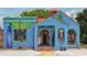 Bright blue storefront with rentals and open sign at 317 Beach Rd, Sarasota, FL 34242