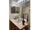 Bathroom with large vanity and bright lighting at 3453 Parkridge Cir # 18-101, Sarasota, FL 34243