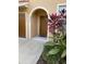 Townhome entryway featuring tropical landscaping, and covered entry at 3453 Parkridge Cir # 18-101, Sarasota, FL 34243