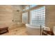 Spa-like bathroom featuring a soaking tub and walk-in shower at 3598 Fair Oaks Ln, Longboat Key, FL 34228